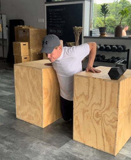 Scott performing dips during a personal training session in Huntington.